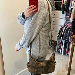 Camo Frye bag. Flaw on one outside zpper pocket.